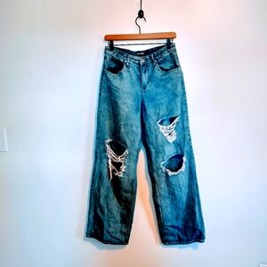 Hot Topic wide leg jeans with distressed holes at the knees. Size 7